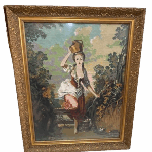 Punto de cruz de una mujer con cántaro en paisaje rural